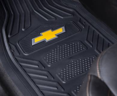 A car floor mat with the Chevrolet logo displayed